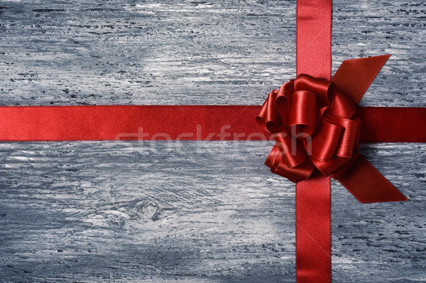 Stock photo: red gift ribbon bow on a wooden surface