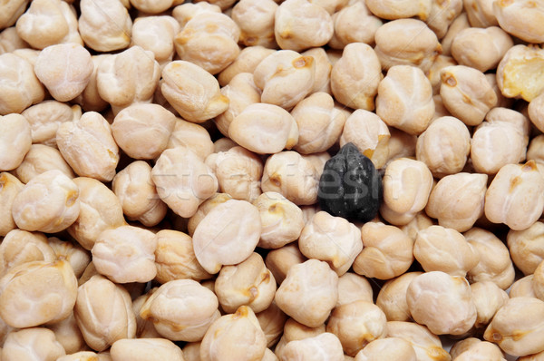 a black chickpea in a pile of dried chickpeas Stock photo © nito