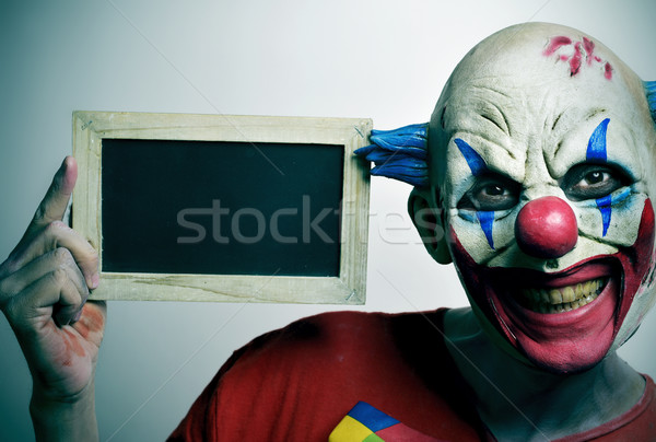evil clown with a blank chalkboard Stock photo © nito