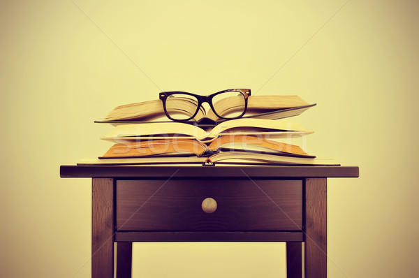 books and eyeglasses on a desk, with a retro effect Stock photo © nito