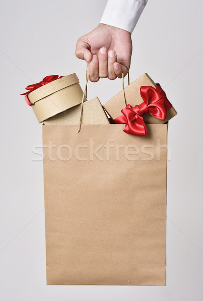 man with a shopping bag full of gift boxes Stock photo © nito