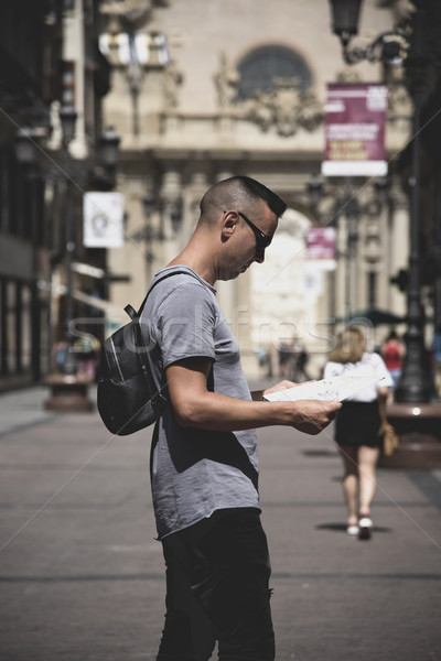 man observing a city map in Zaragoza, Spain Stock photo © nito