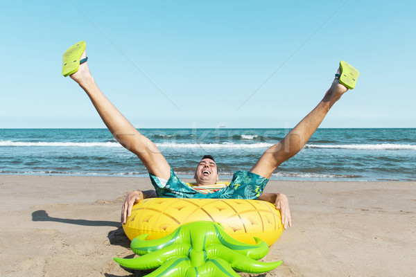 Mann schwimmen Ring Form Ananas lachen Stock foto © nito