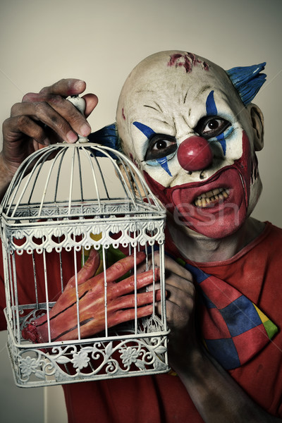 scary evil clown with an amputated hand Stock photo © nito