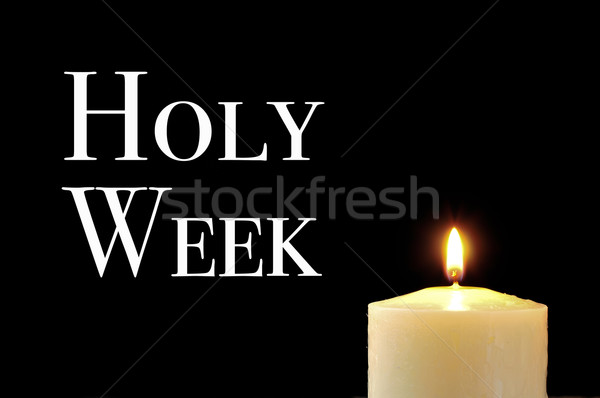 a lit candle and the text holy week Stock photo © nito