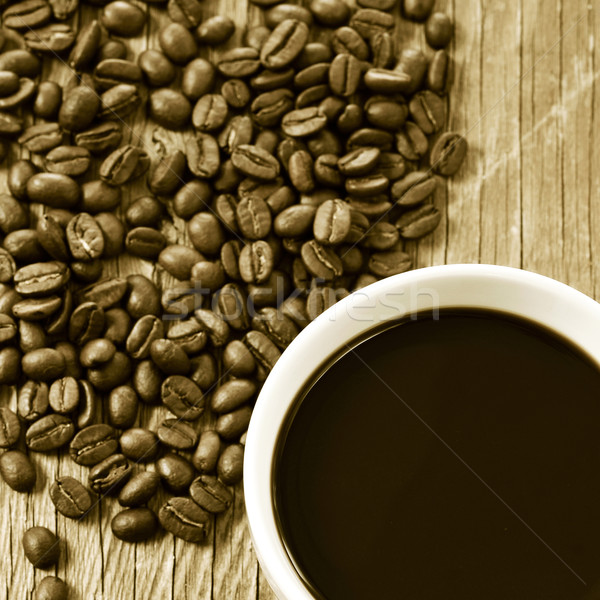 cup of coffee and roasted coffee beans, in sepia toning Stock photo © nito