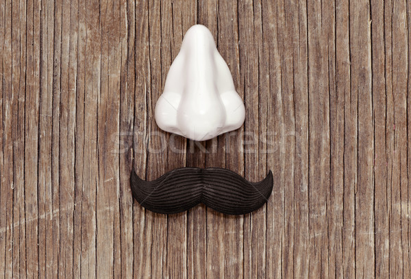 fake mustache and nose on a wooden surface Stock photo © nito