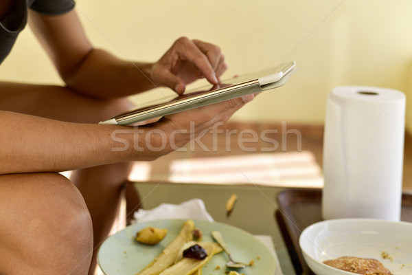 young man using a tablet Stock photo © nito