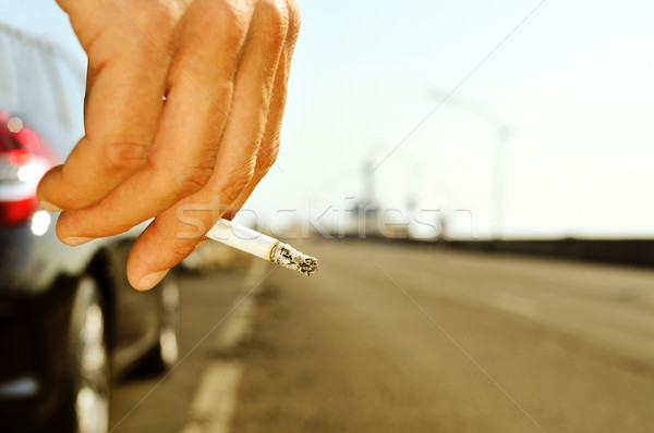 man smoking on a no traffic road Stock photo © nito