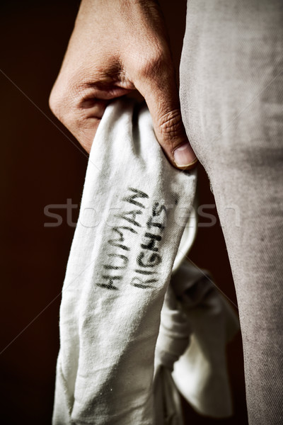 Stock photo: young man with a blindfold with the text human rights