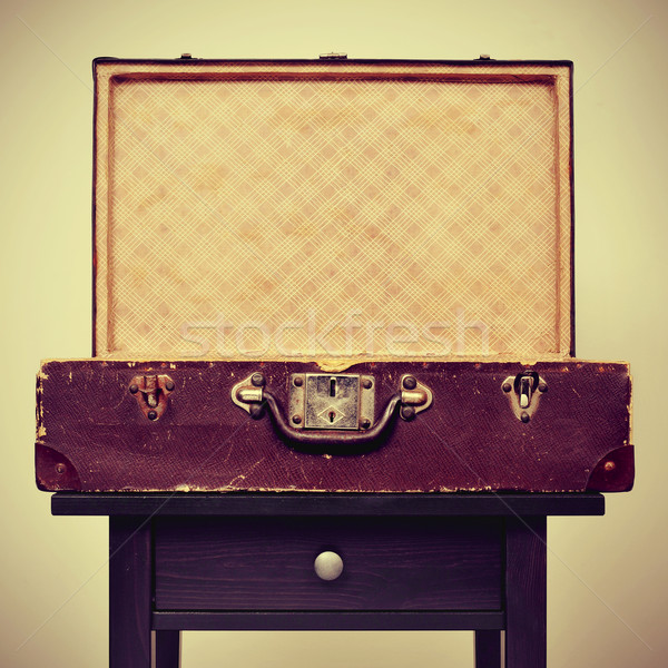 old suitcase on a table, with a retro effect Stock photo © nito