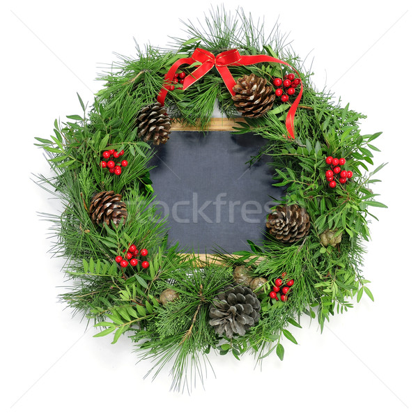 Stock photo: christmas wreath and a blank chalkboard