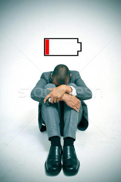 young businessman with low battery Stock photo © nito