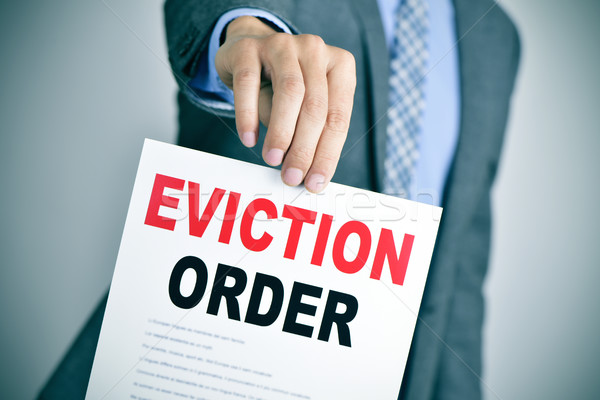 man in suit with an eviction order Stock photo © nito