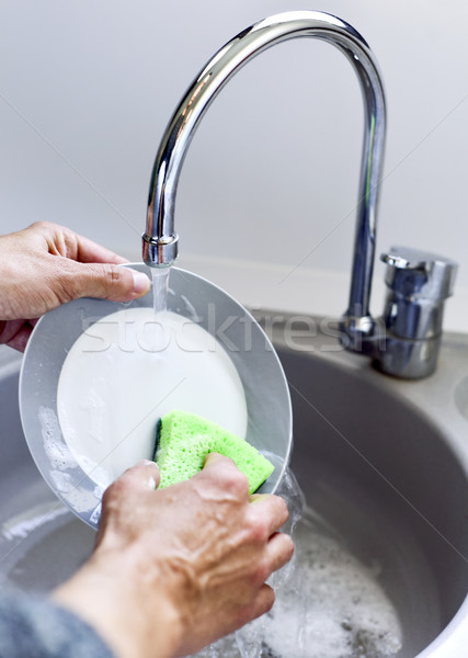 young man washing dishes Stock photo © nito
