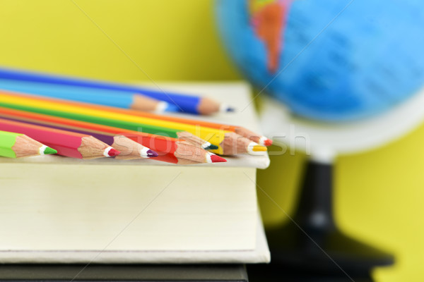 pencil crayons, books and terrestrial globe Stock photo © nito