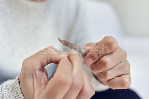 young man polishing his fingernails Stock photo © nito