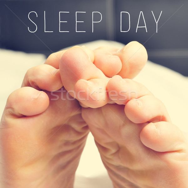 the feet of a man in bed and text sleep day Stock photo © nito