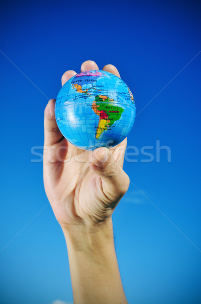 young man with a world globe in his hand, vignetted Stock photo © nito