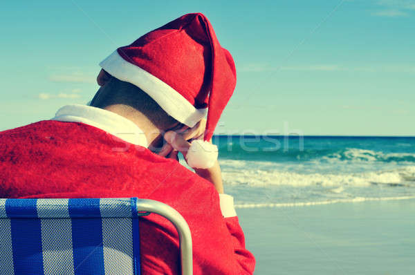Święty mikołaj drzemka plaży leżak strony Zdjęcia stock © nito