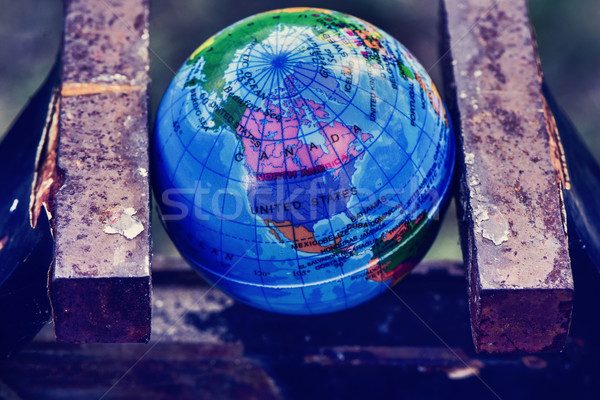 world globe in a vise Stock photo © nito