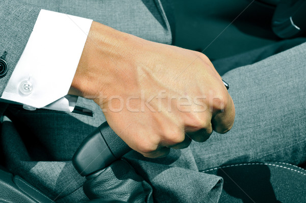man in suit pulling the hand brake of a car Stock photo © nito
