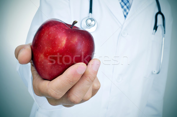 doctor wiht an apple, depicting the idea of the healthy eating Stock photo © nito