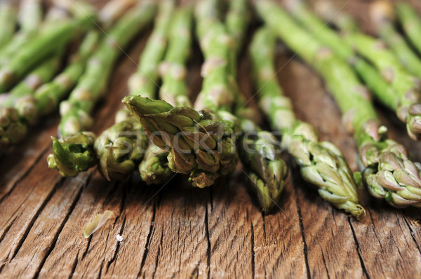 raw asparagus on a rustic wooden table, filtered Stock photo © nito