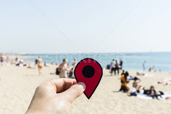 man with a red marker in La Barceloneta beach Stock photo © nito