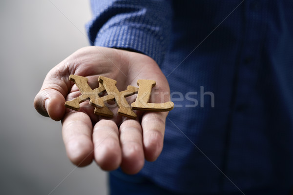 Stock photo: text XXL in the hand of a man