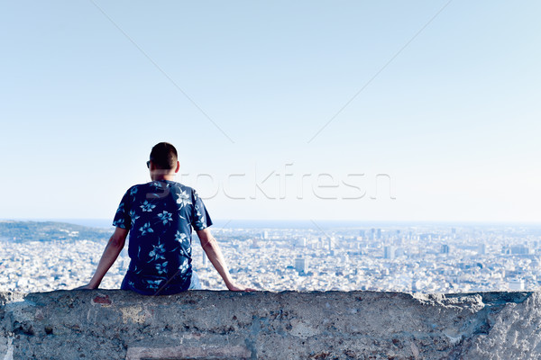 young man with the city bellow him Stock photo © nito