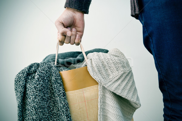 man with a shopping bag with clothes Stock photo © nito