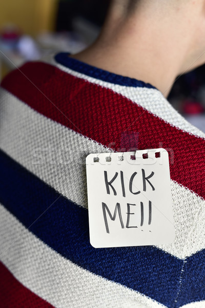 man with a note with the text kick me Stock photo © nito