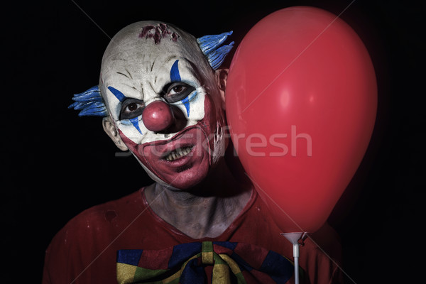 scary evil clown with a red balloon Stock photo © nito