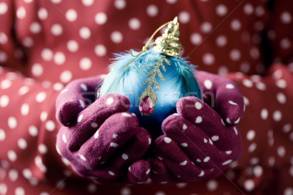 woman with an ornamented christmas ball Stock photo © nito
