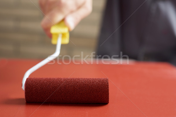 young man painting a wooden board Stock photo © nito