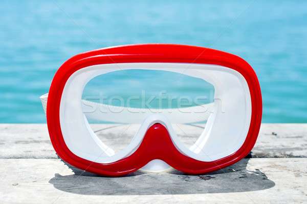 diving mask on an old wooden pier above the sea Stock photo © nito