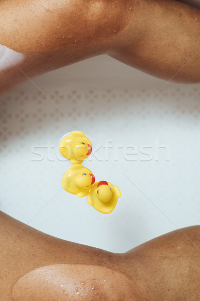 man relaxing in the bathtub with rubber ducks Stock photo © nito