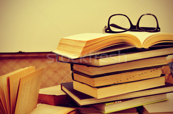 books and eyeglasses in an old suitcase, with a retro effect Stock photo © nito