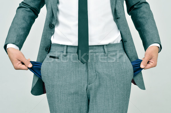 broke businessman showing his empty pockets Stock photo © nito