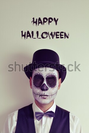 man with calaveras makeup and signboard with text halloween nigh Stock photo © nito