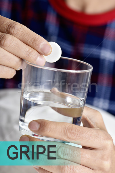 text gripe, cold in spanish, and man taking a pill Stock photo © nito