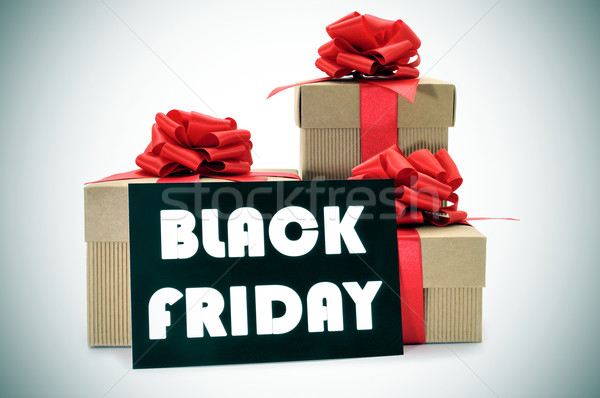 gifts and a signboard with the text black friday Stock photo © nito