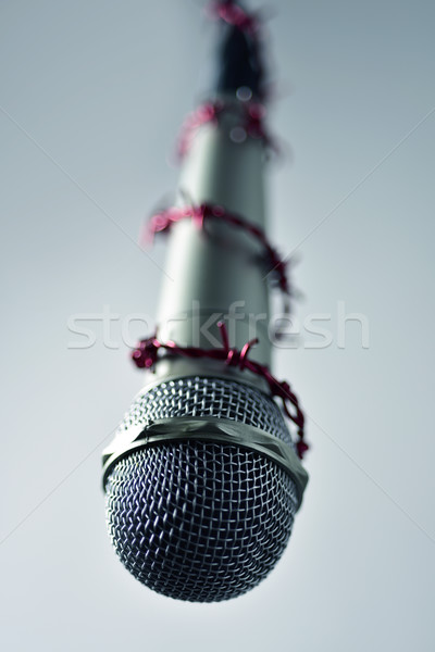 Szögesdrót körül mikrofon közelkép piros ötlet Stock fotó © nito