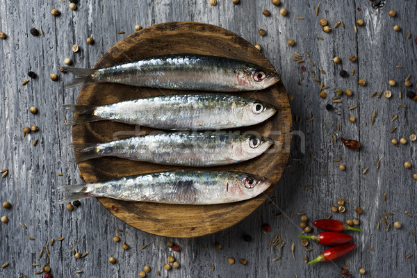 raw sardines on a rustic wooden table Stock photo © nito