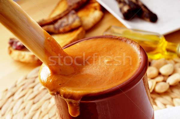 barbecued calcot, sweet onion, dipped in romesco sauce typical o Stock photo © nito