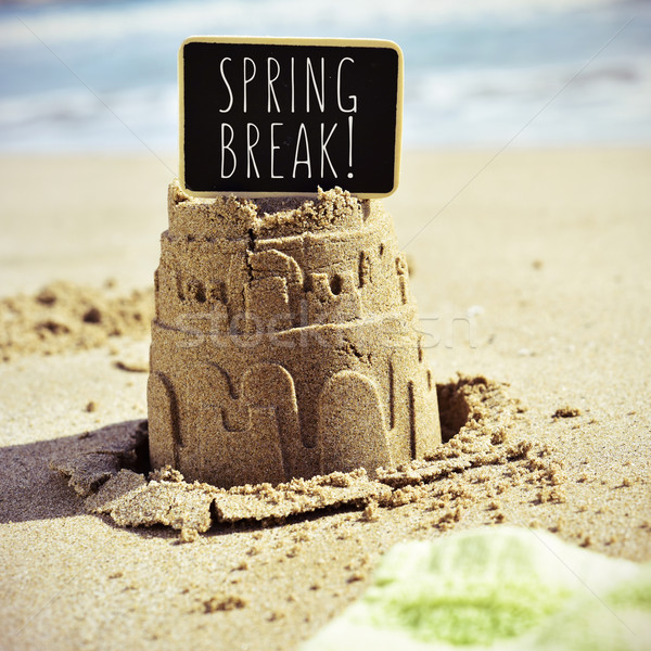 signboard with the text spring break on a sandcastle Stock photo © nito