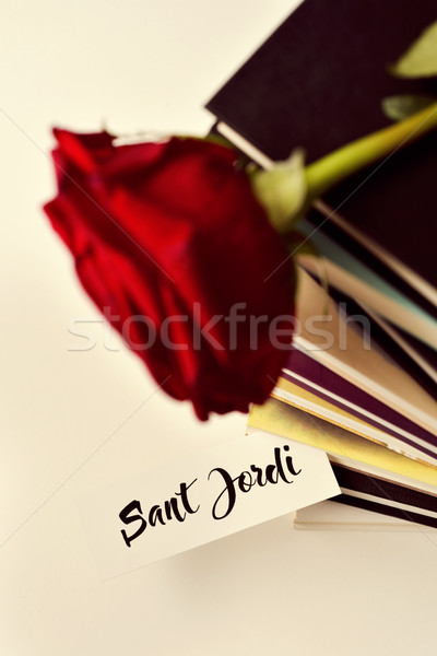 books, red rose and text Sant Jordi Stock photo © nito