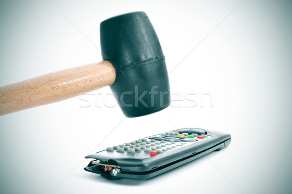 broking a remote control with a hammer Stock photo © nito