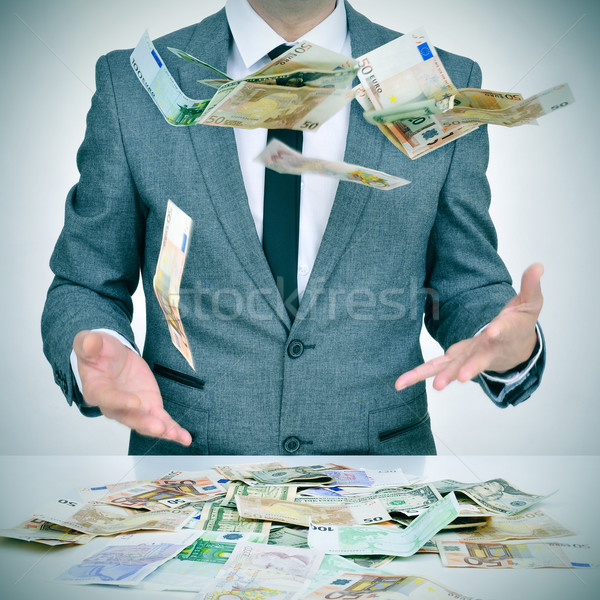man trying to catch money falling from the sky Stock photo © nito